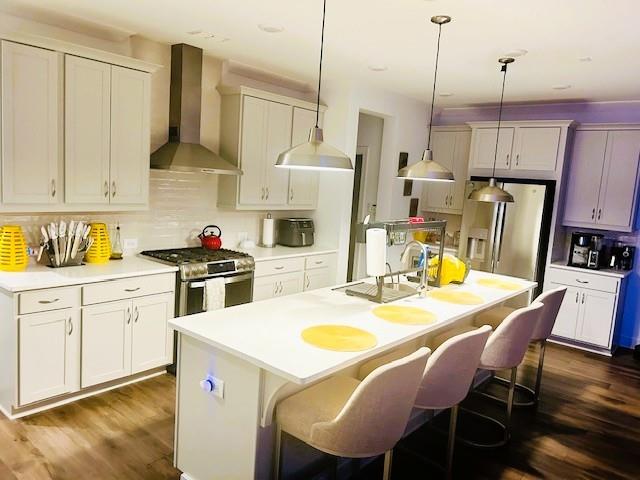 5236 Riden Court Buford, GA 30518 - Photo 10 of 41 a view of kitchen with refrigerator a stove and wooden floors