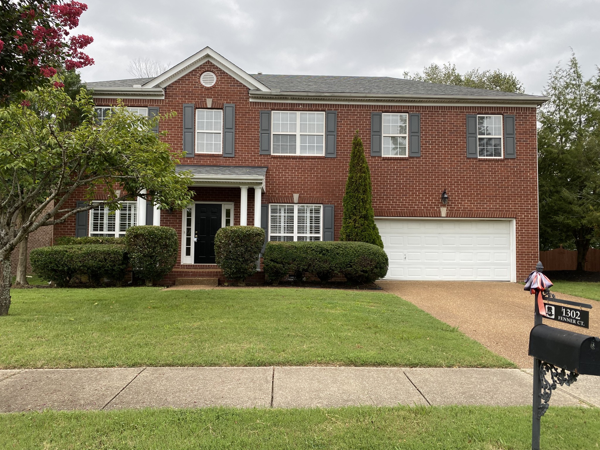 1302 Fenner Court Franklin, TN 37067 - Photo 1 of 26 a front view of a house with a yard