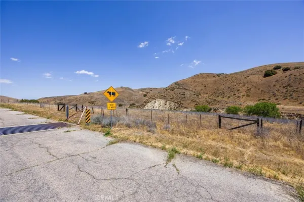 a view of a road with a building in the background