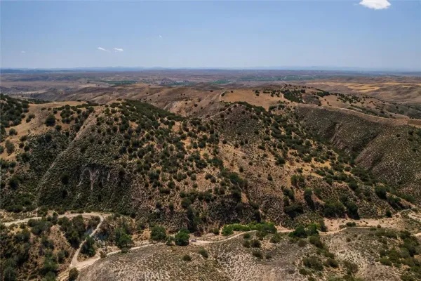 an aerial view of mountain with beach
