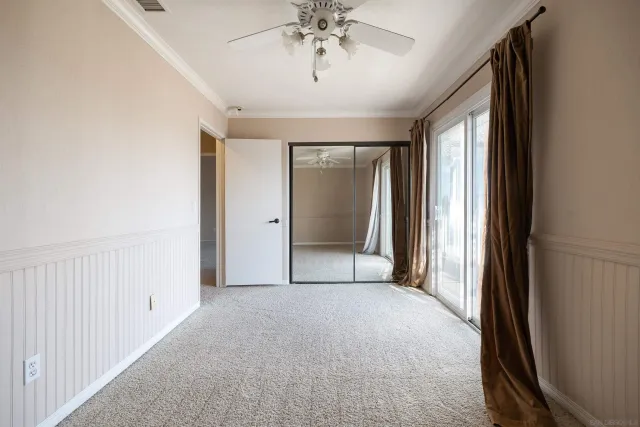 a view of a hallway with a chandelier