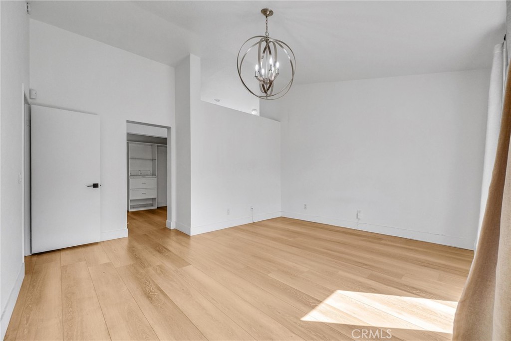 24461 Willow Run Road Moreno Valley, CA 92557 - Photo 13 of 24 a view of empty room with wooden floor and fan
