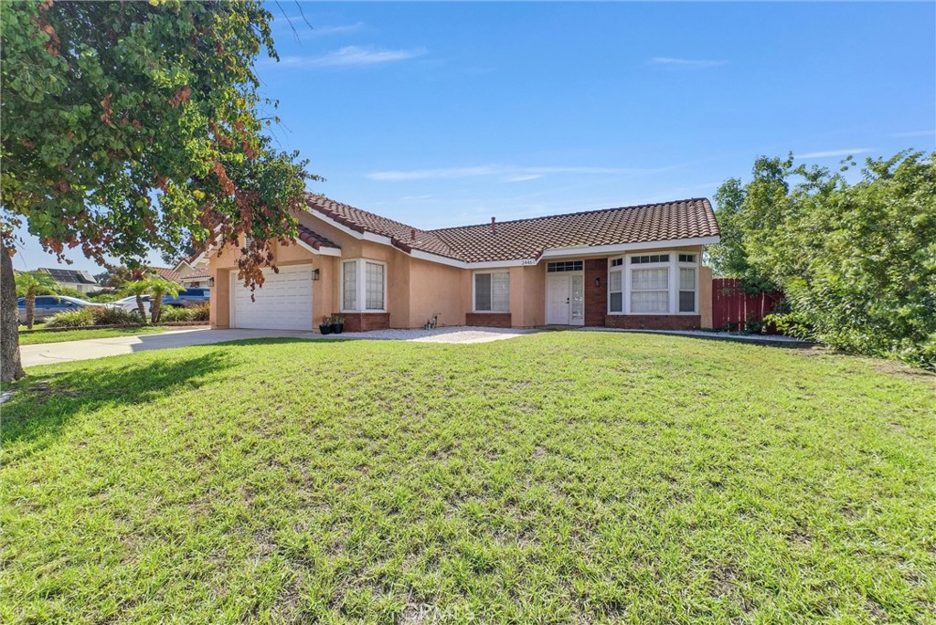 24461 Willow Run Road Moreno Valley, CA 92557 - Photo 2 of 24 front view of a house with a yard