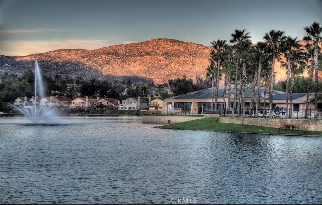 24461 Willow Run Road Moreno Valley, CA 92557 - Photo 22 of 24 a view of a lake with a mountain in the background