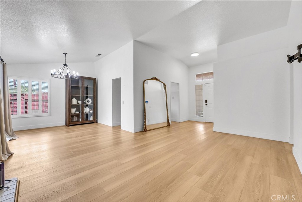 24461 Willow Run Road Moreno Valley, CA 92557 - Photo 4 of 24 a view of a room with wooden floor