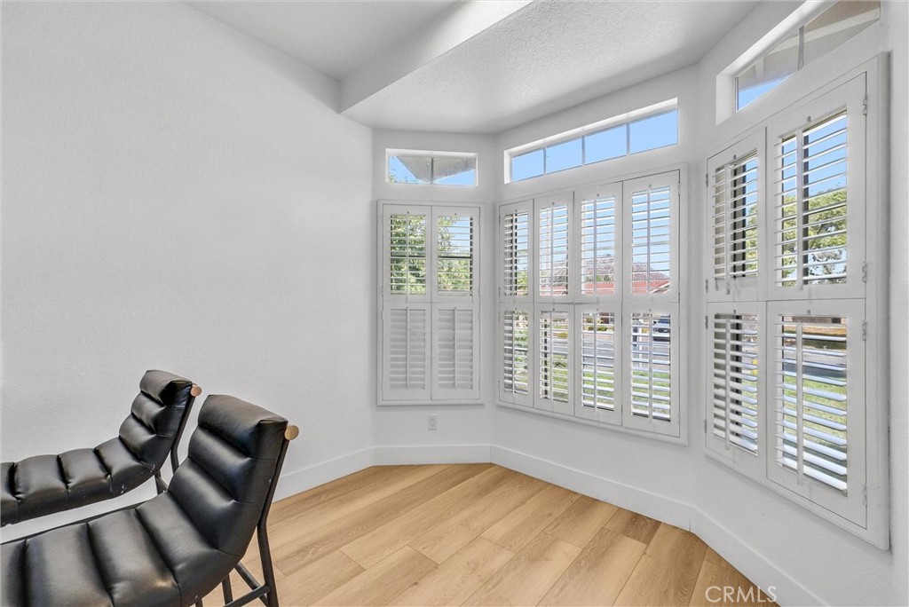 24461 Willow Run Road Moreno Valley, CA 92557 - Photo 10 of 24 a view of a livingroom with lounge chair and a large window