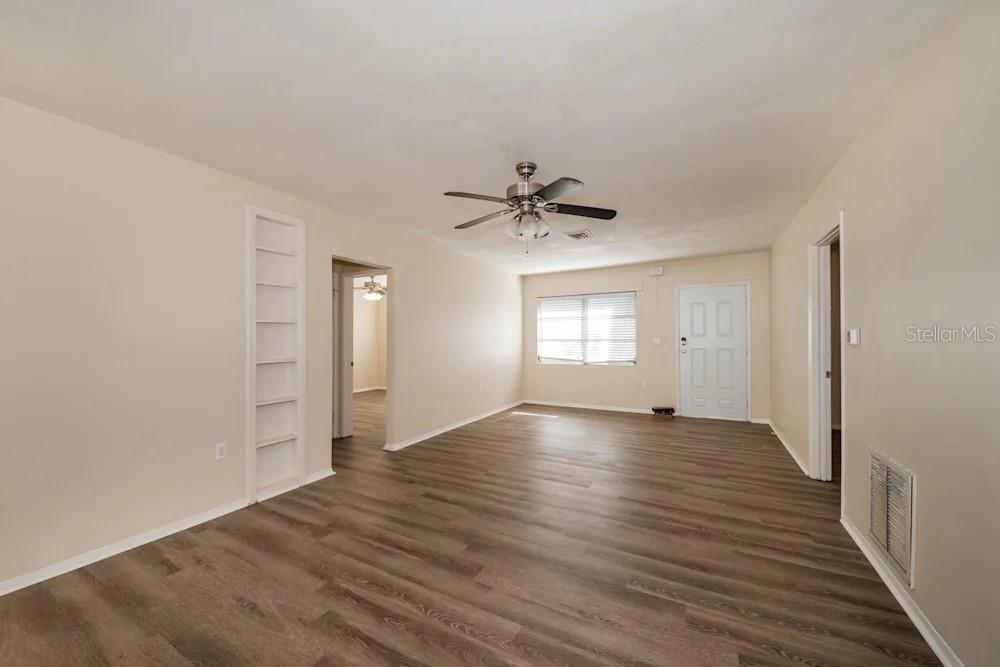 1109 Myrtle Avenue Venice, FL 34285 - Photo 12 of 15 a view of an empty room with window and wooden floor