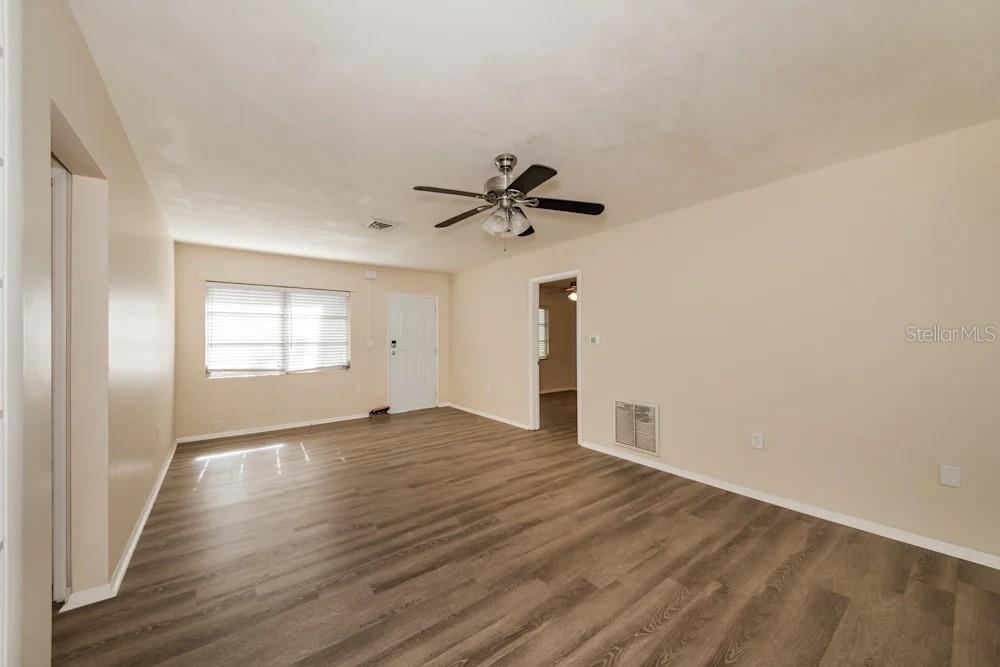 1109 Myrtle Avenue Venice, FL 34285 - Photo 13 of 15 a view of empty room with wooden floor and ceiling fan