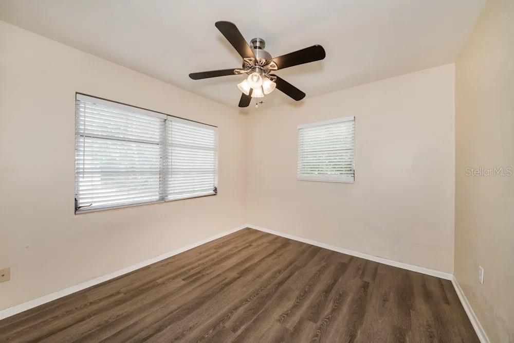 1109 Myrtle Avenue Venice, FL 34285 - Photo 14 of 15 a view of wooden floor and a chandelier fan in a room