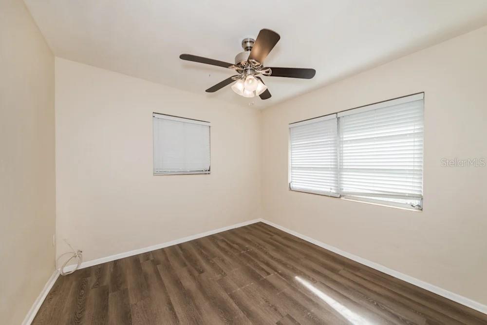 1109 Myrtle Avenue Venice, FL 34285 - Photo 2 of 15 a view of empty room with wooden floor and fan