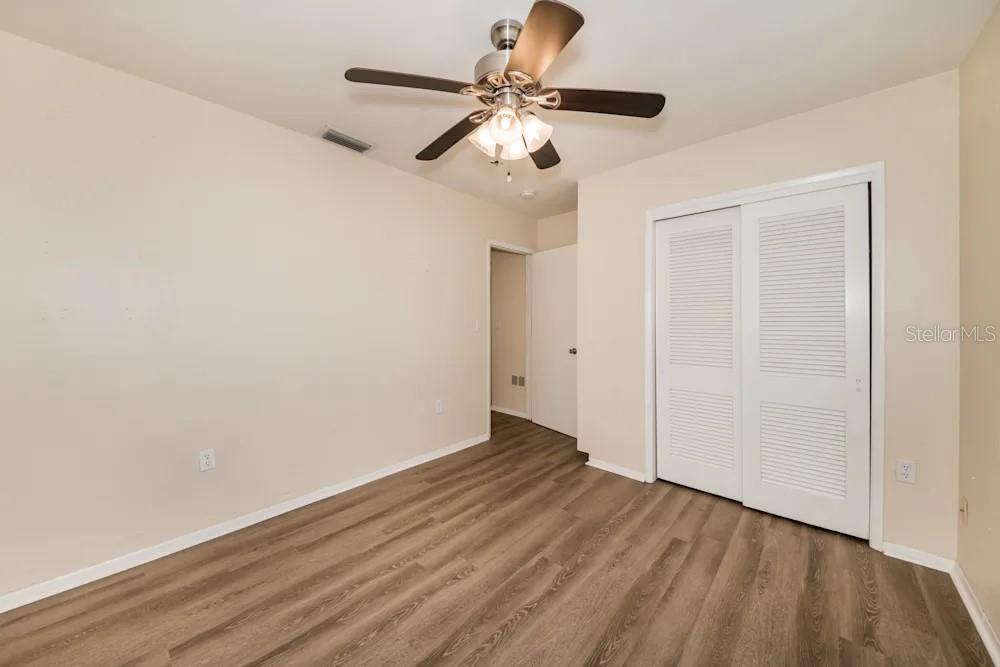 1109 Myrtle Avenue Venice, FL 34285 - Photo 3 of 15 a view of an empty room with wooden floor