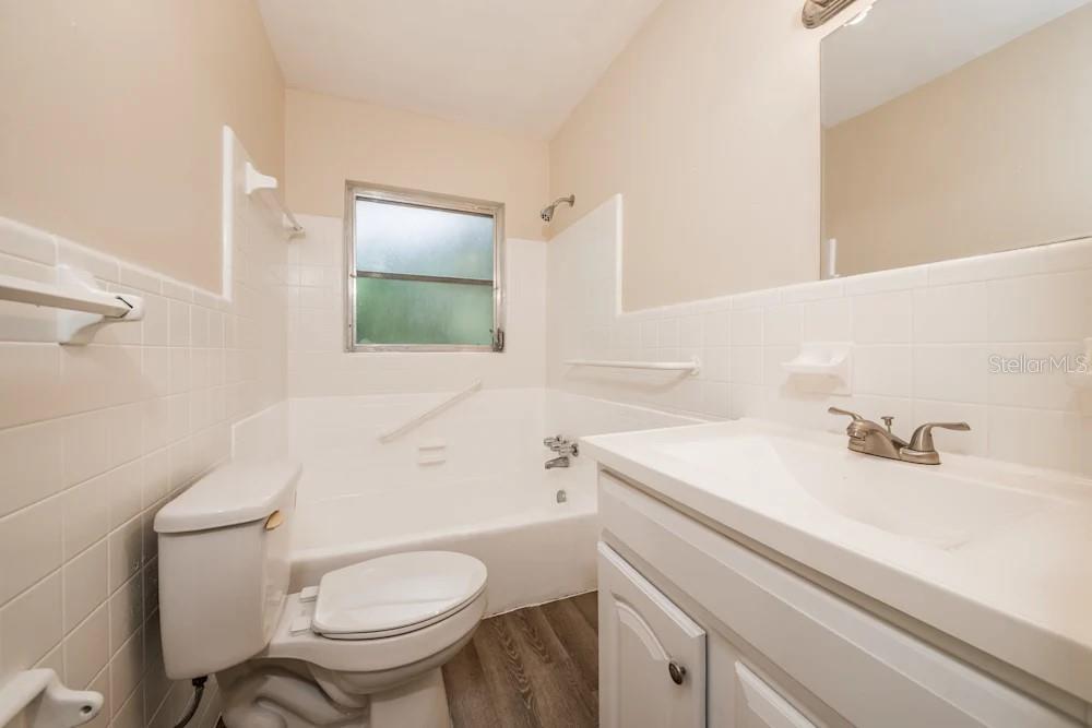 1109 Myrtle Avenue Venice, FL 34285 - Photo 4 of 15 a bathroom with a sink toilet and mirror