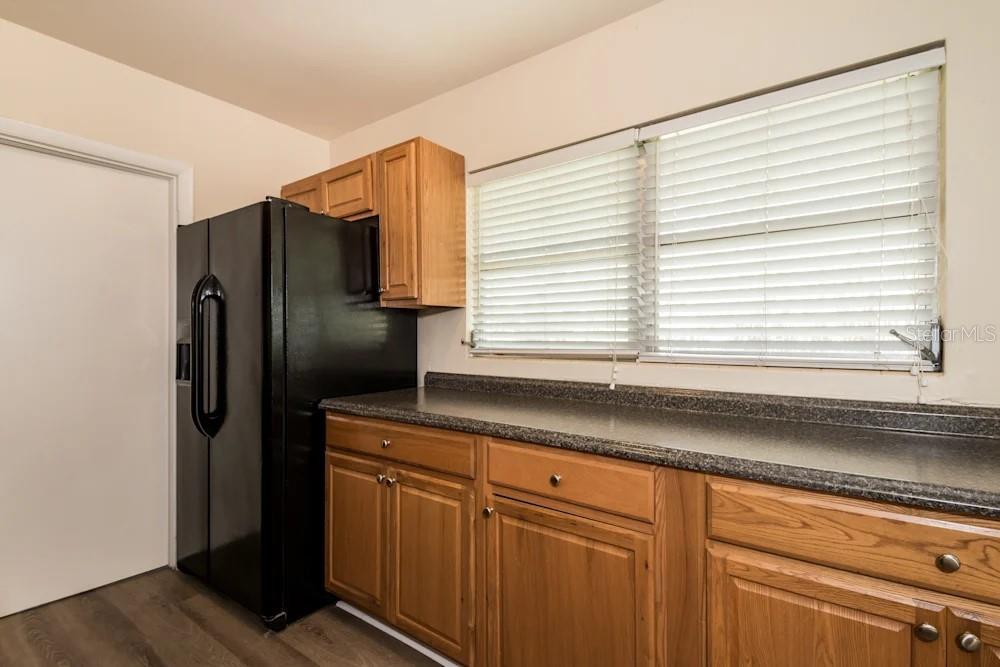 1109 Myrtle Avenue Venice, FL 34285 - Photo 9 of 15 a kitchen with stainless steel appliances granite countertop a refrigerator and a sink