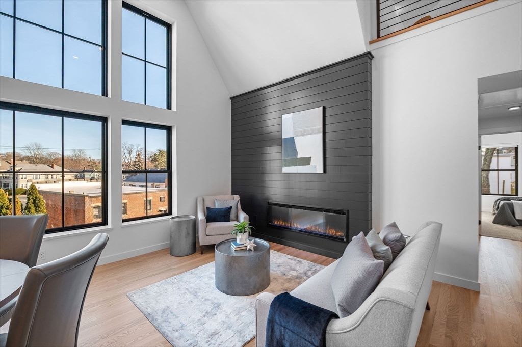 11 Boynton Street, Unit 204 Swampscott, MA 01907 - Photo 12 of 42 a living room with furniture and a window