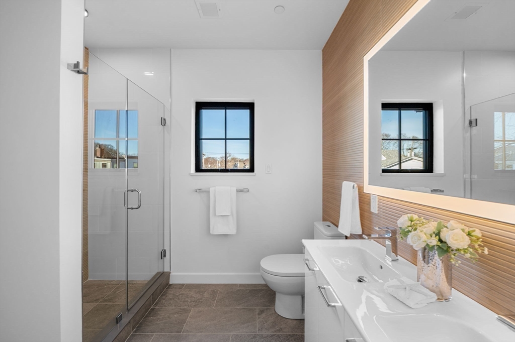 11 Boynton Street, Unit 204 Swampscott, MA 01907 - Photo 25 of 42 a bathroom with a sink toilet and shower