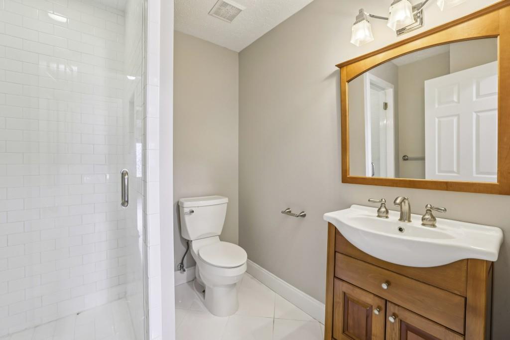 4972 Vermack Road Atlanta, GA 30338 - Photo 11 of 46 a bathroom with a sink toilet and vanity