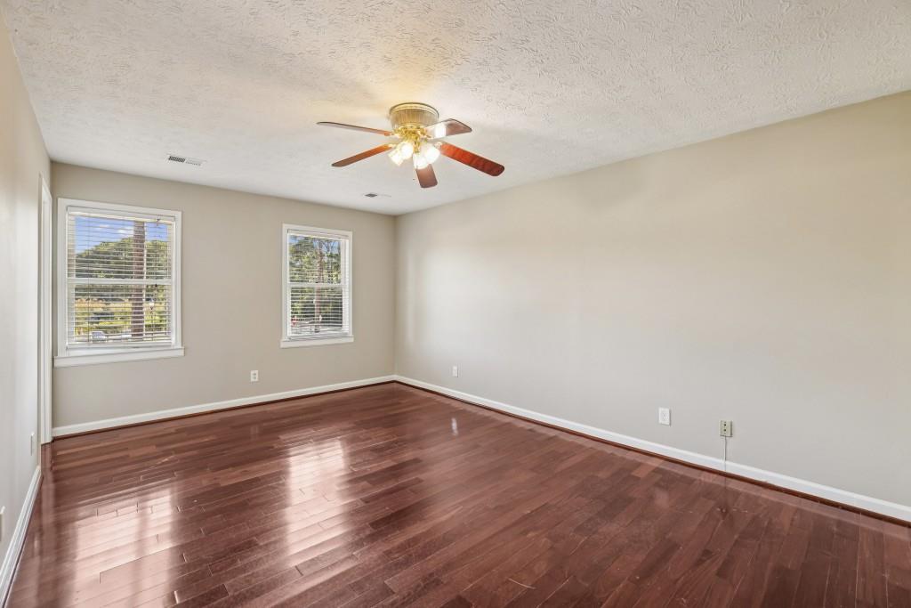 4972 Vermack Road Atlanta, GA 30338 - Photo 13 of 46 a view of an empty room with wooden floor and a window