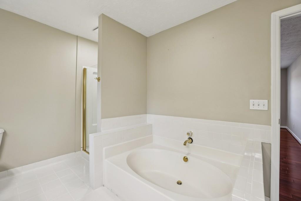 4972 Vermack Road Atlanta, GA 30338 - Photo 16 of 46 a white bath tub sitting in a bathroom