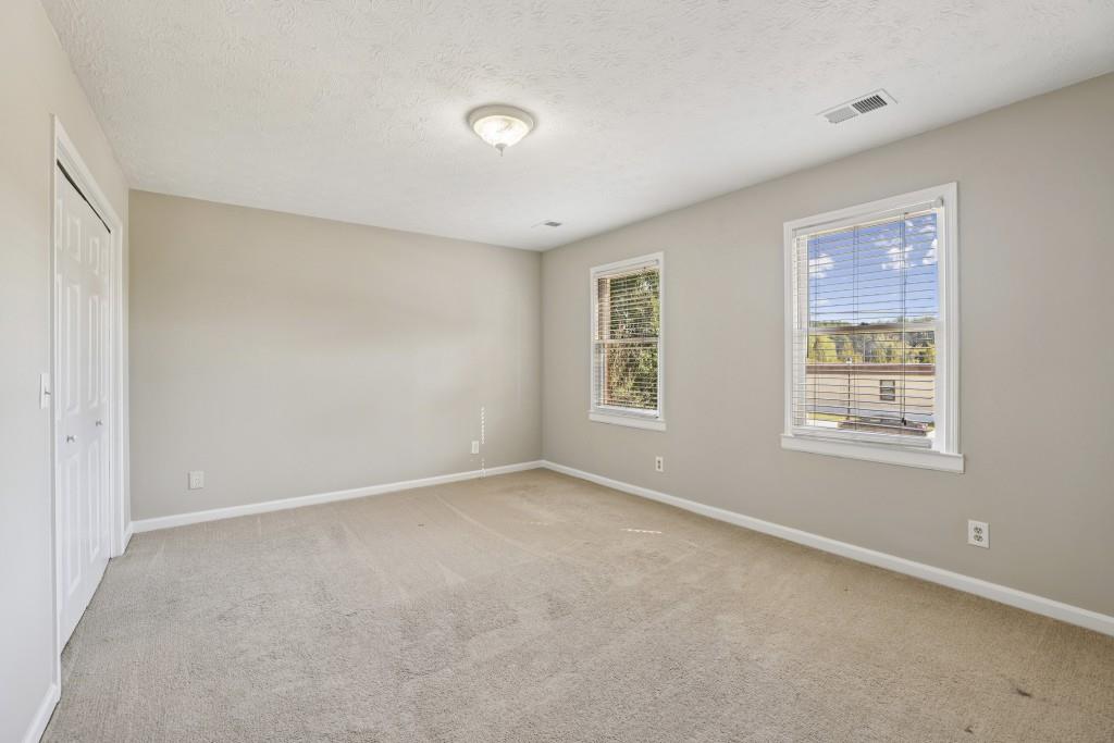4972 Vermack Road Atlanta, GA 30338 - Photo 17 of 46 a view of an empty room with a window
