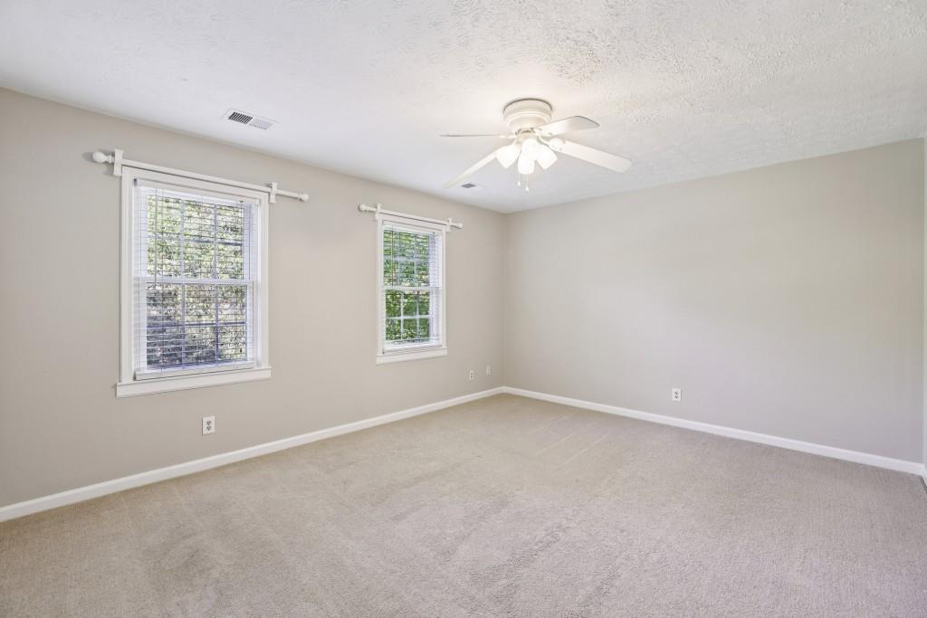 4972 Vermack Road Atlanta, GA 30338 - Photo 19 of 46 an empty room with a window and a fan
