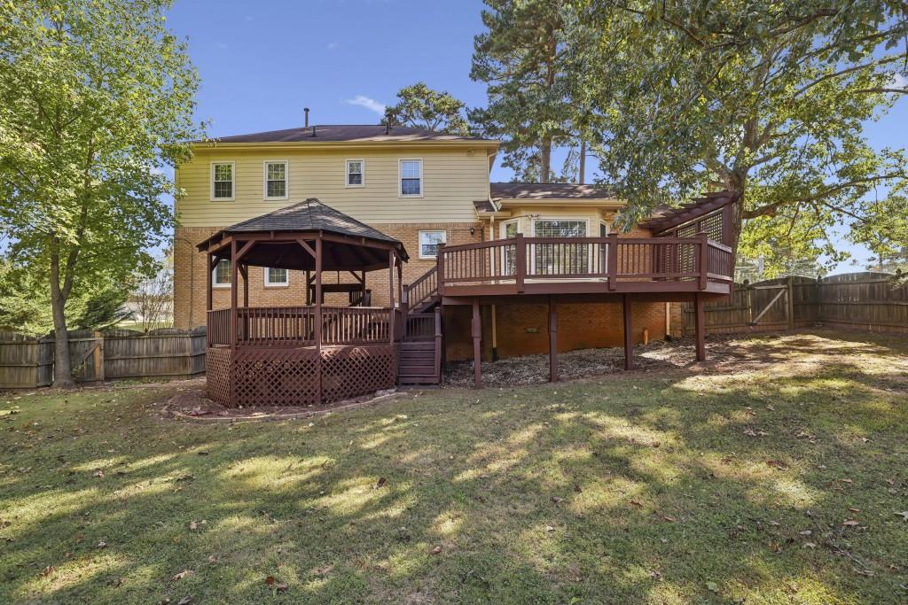4972 Vermack Road Atlanta, GA 30338 - Photo 21 of 46 a view of a house with a yard