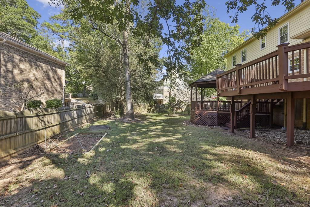 4972 Vermack Road Atlanta, GA 30338 - Photo 22 of 46 a view of a house with backyard porch and sitting area