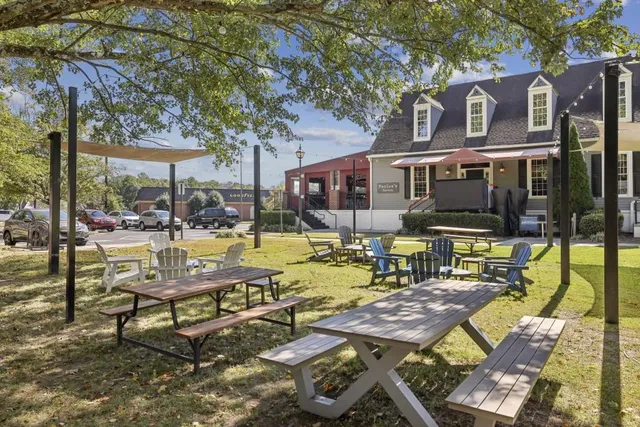 a view of a patio with swimming pool table and chairs