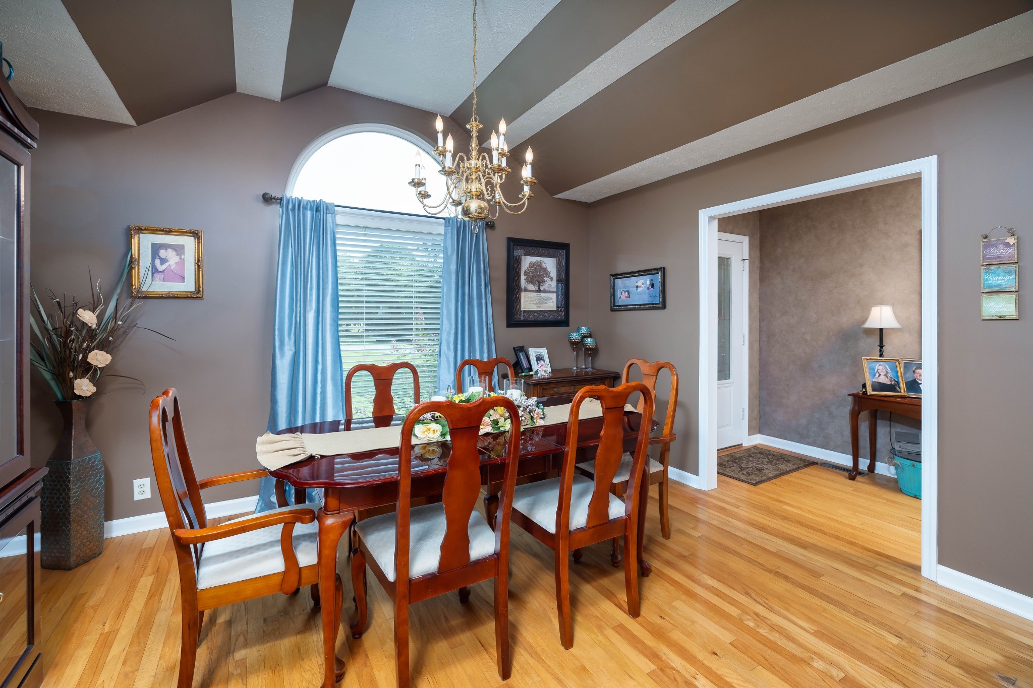 232 Trice Road Lebanon, TN 37087 - Photo 15 of 43 a view of a dining room with furniture a chandelier and wooden floor