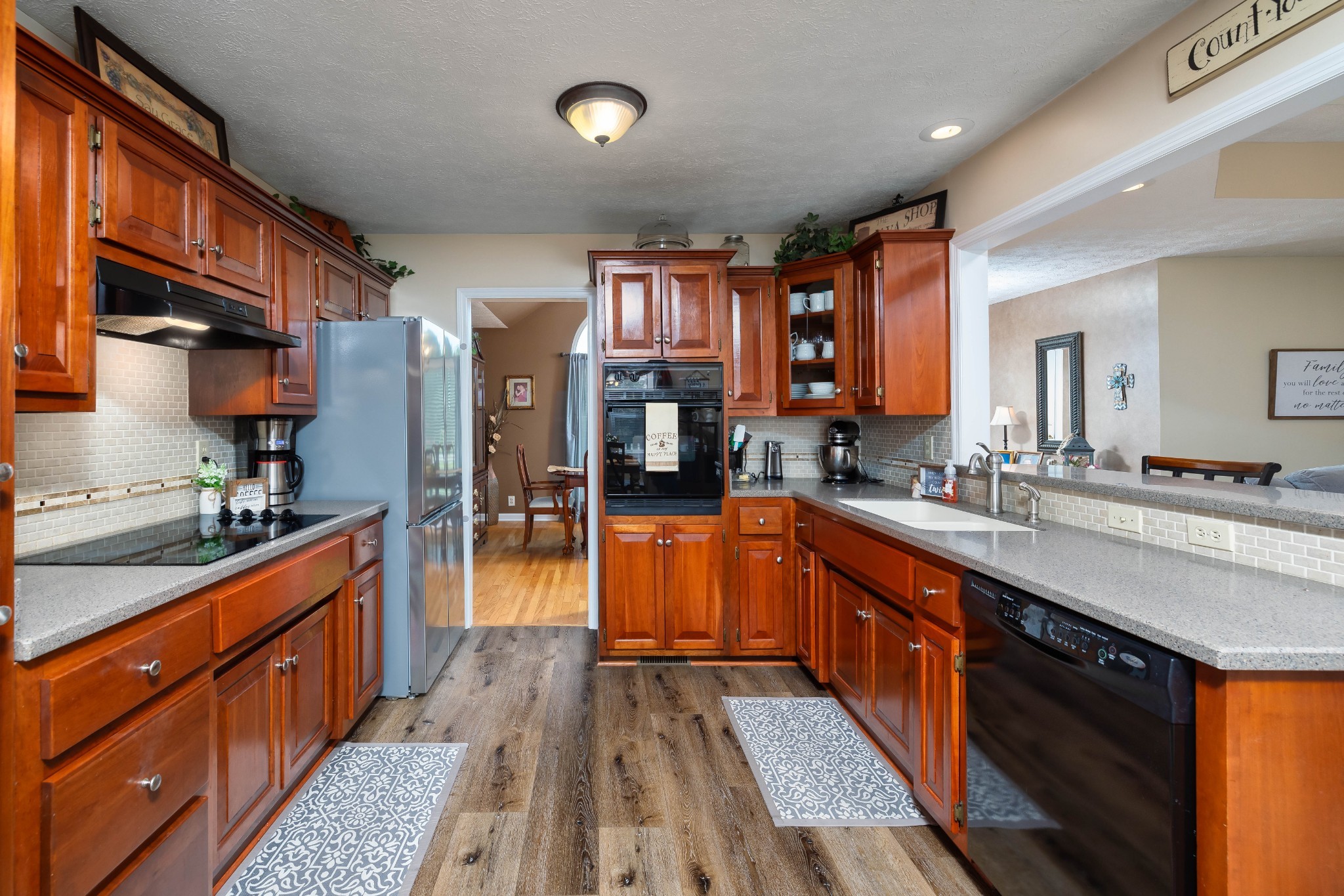 232 Trice Road Lebanon, TN 37087 - Photo 18 of 43 a large kitchen with stainless steel appliances granite countertop a stove a sink dishwasher and a refrigerator
