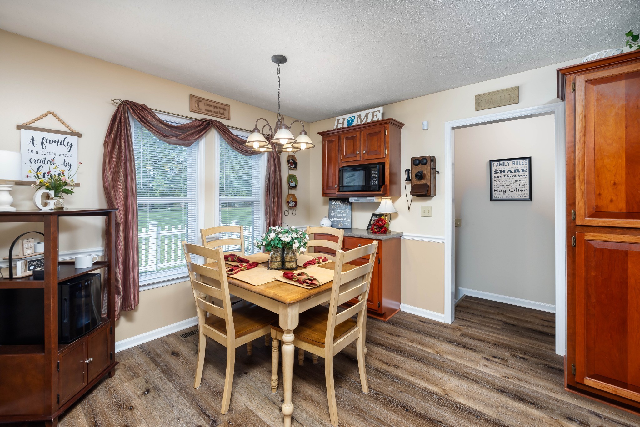 232 Trice Road Lebanon, TN 37087 - Photo 19 of 43 a dining room with furniture a chandelier and wooden floor