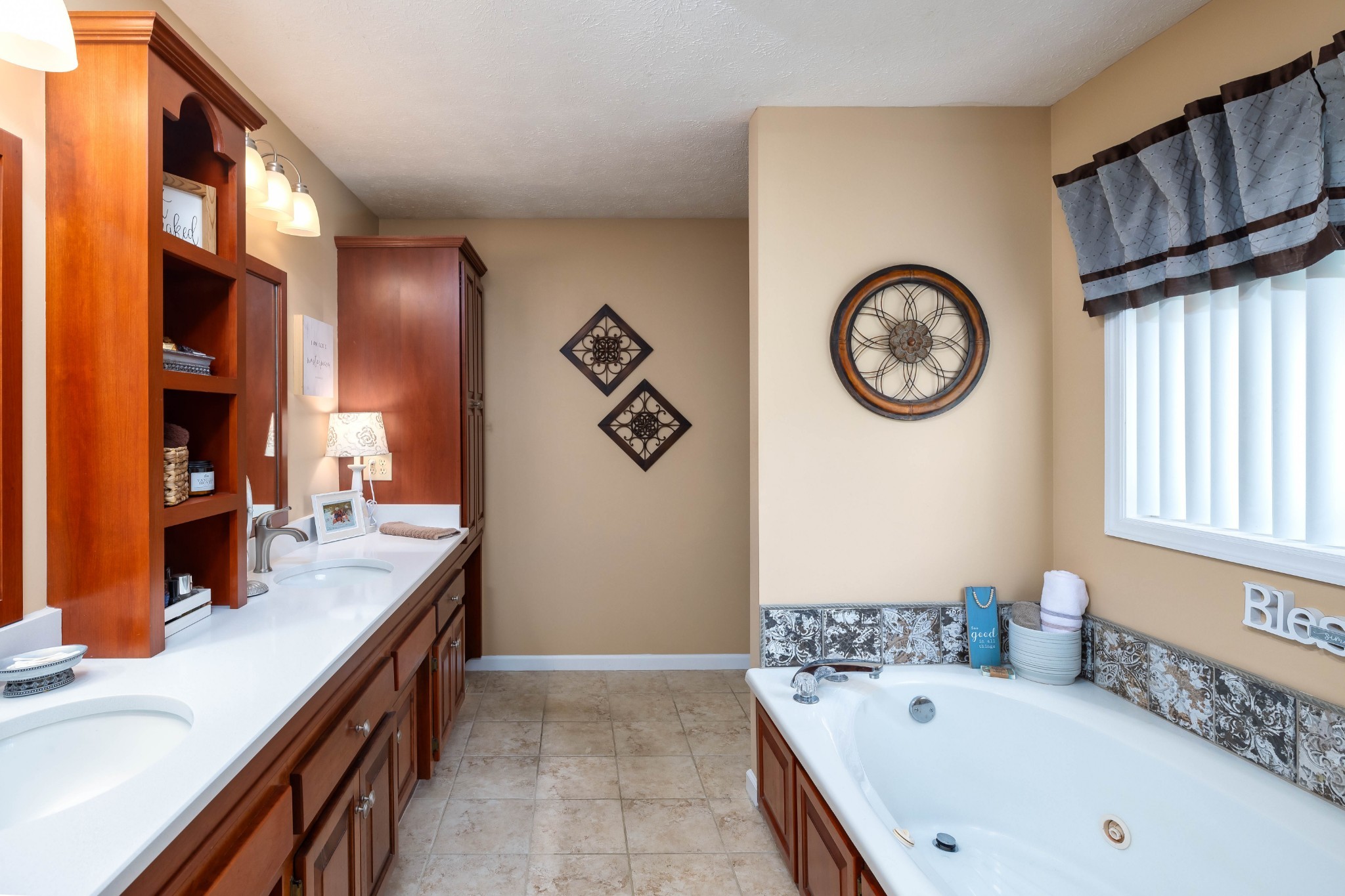 232 Trice Road Lebanon, TN 37087 - Photo 30 of 43 a bathroom with a bathtub a sink and a large mirror