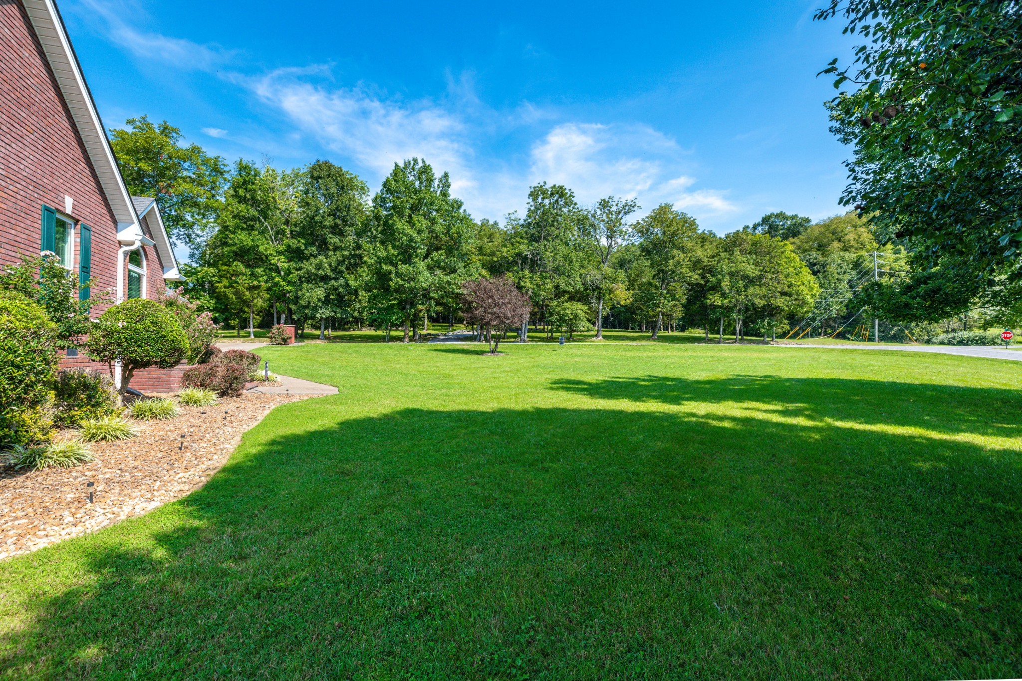232 Trice Road Lebanon, TN 37087 - Photo 3 of 43 a view of a grassy field with trees in the background