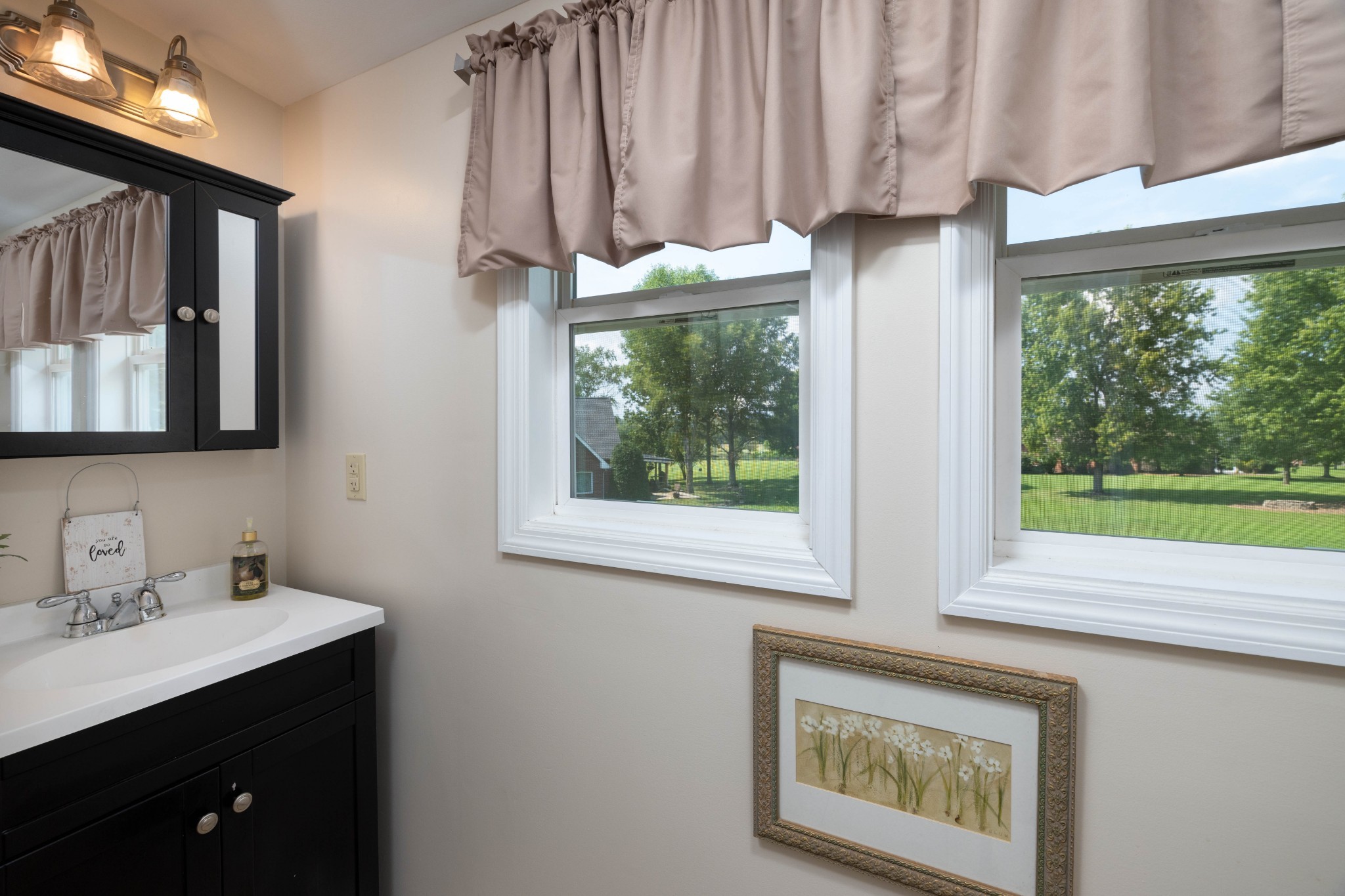 232 Trice Road Lebanon, TN 37087 - Photo 35 of 43 a bathroom with a sink and a mirror