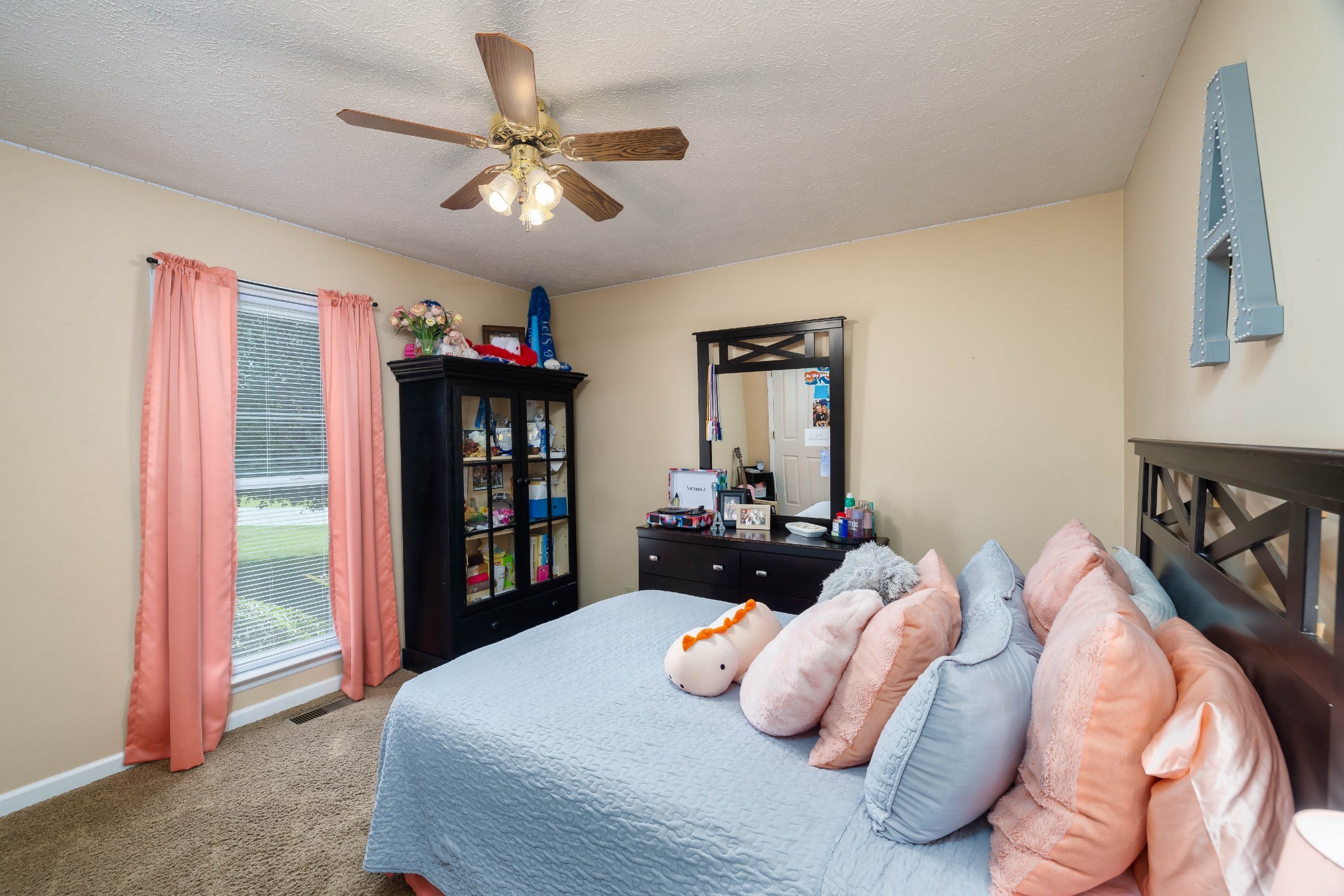 232 Trice Road Lebanon, TN 37087 - Photo 37 of 43 a bedroom with a bed and a bookshelf