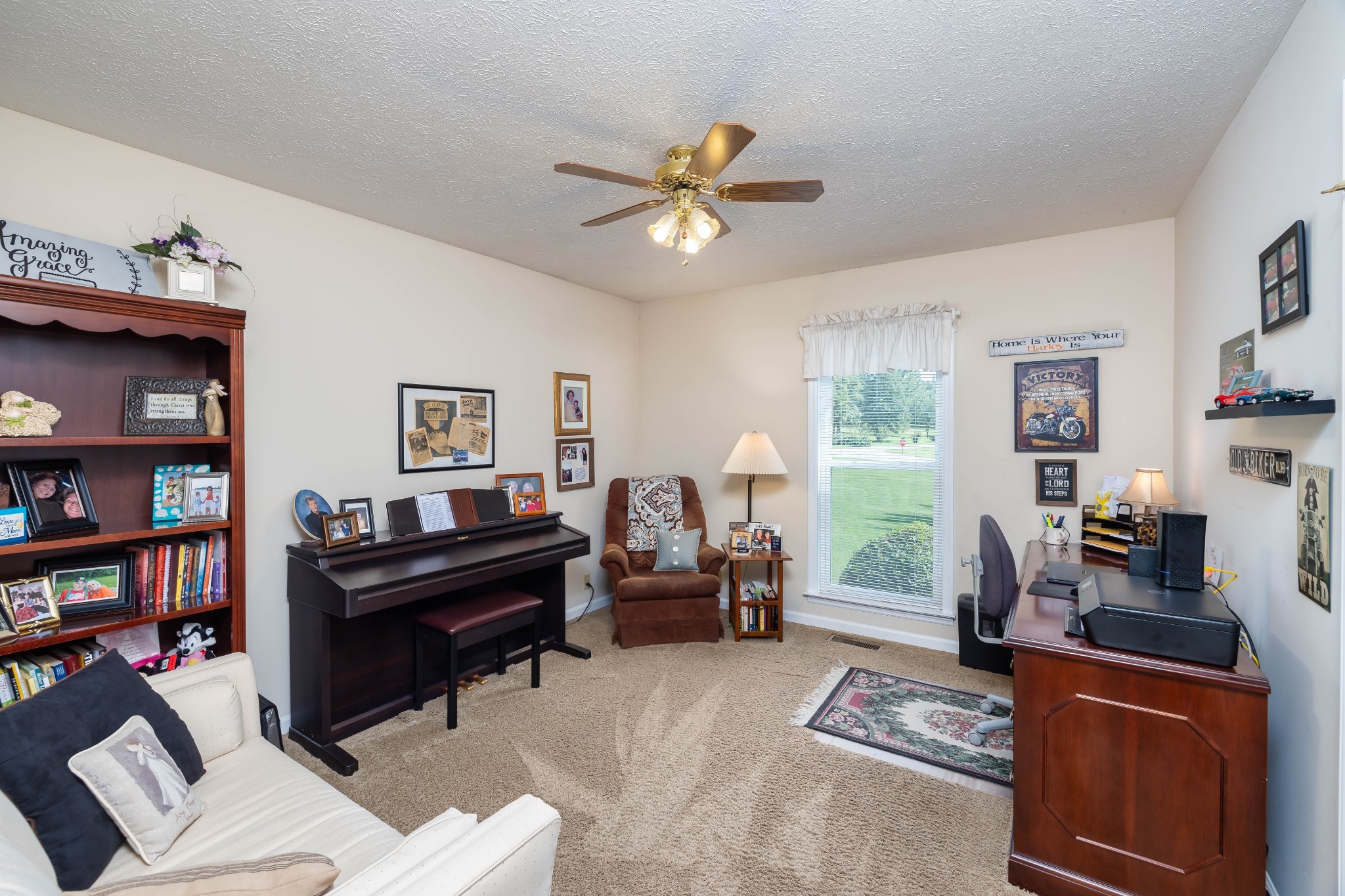 232 Trice Road Lebanon, TN 37087 - Photo 41 of 43 a living room with furniture a bookshelf and a window