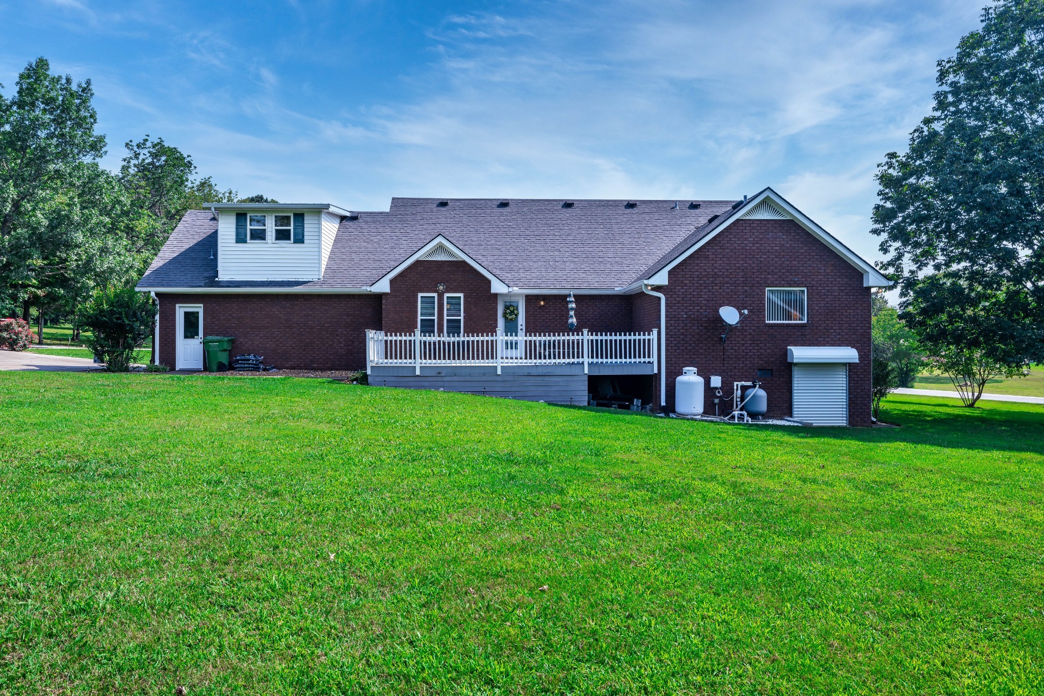 232 Trice Road Lebanon, TN 37087 - Photo 5 of 43 a front view of a house with a garden and yard
