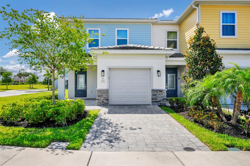 743 Driving Range Court Reunion, FL 34747 - Photo 1 of 38 a front view of a house with garden