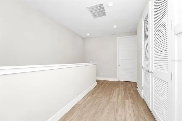 a view of small space with wooden floor