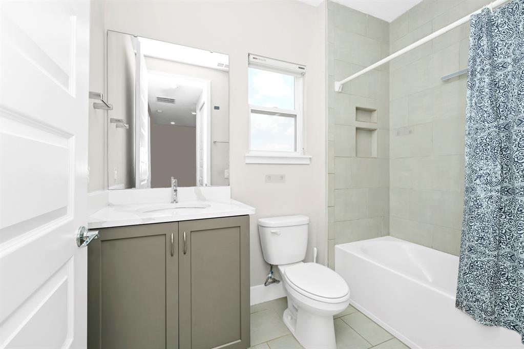 743 Driving Range Court Reunion, FL 34747 - Photo 16 of 38 a bathroom with a sink toilet and shower