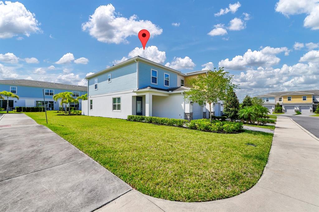 743 Driving Range Court Reunion, FL 34747 - Photo 22 of 38 a view of a house with a backyard porch and sitting area