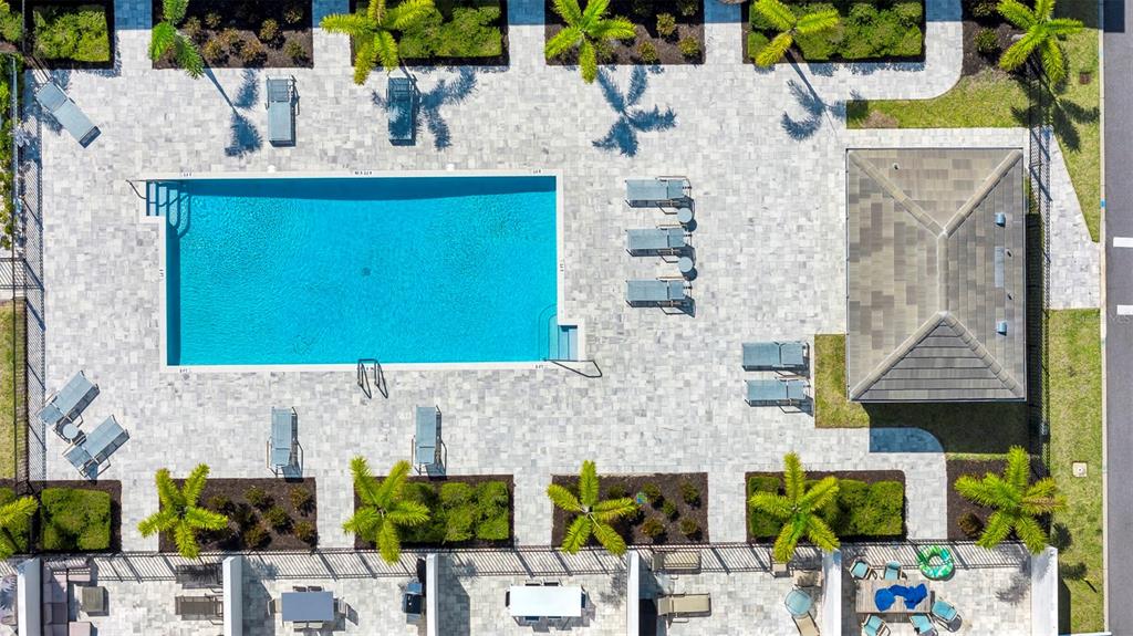 743 Driving Range Court Reunion, FL 34747 - Photo 30 of 38 a building with table and chairs