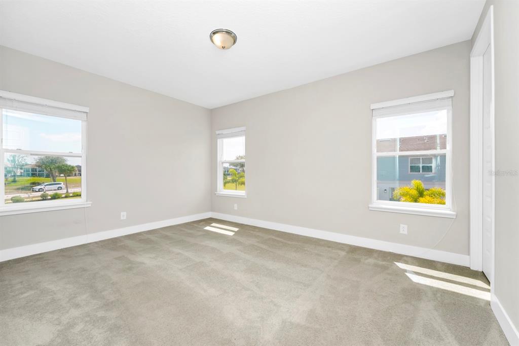 743 Driving Range Court Reunion, FL 34747 - Photo 10 of 38 an empty room with a window