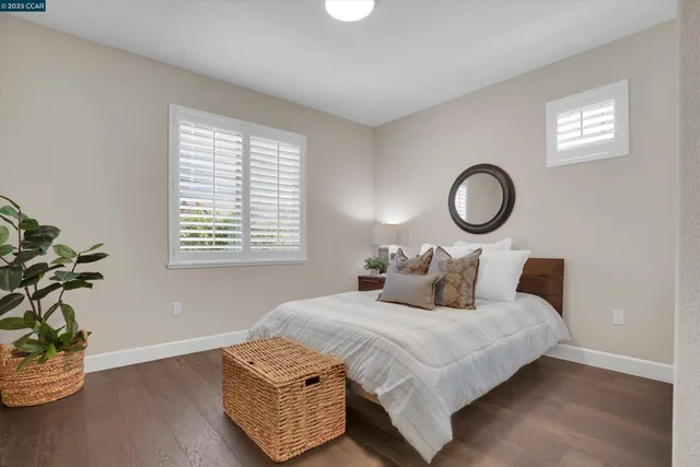 a bedroom with bed and a window