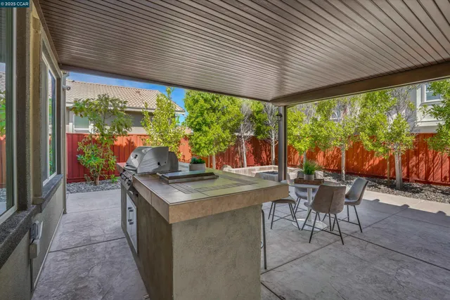 a dining room with furniture and garden view