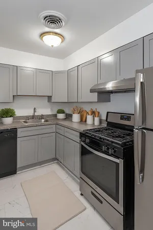 a kitchen with a stove and a refrigerator