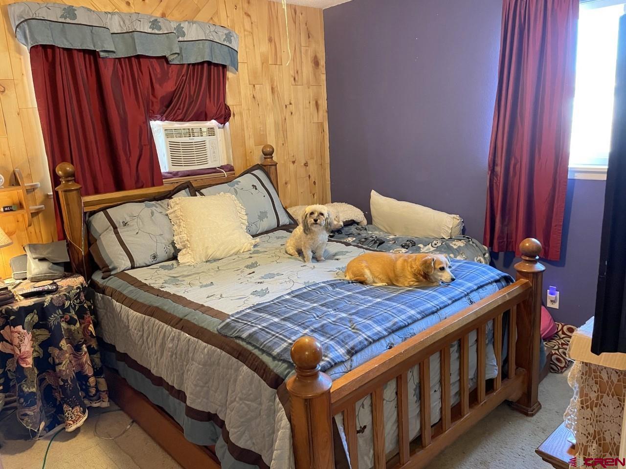 1201 Frontier Road Delta, CO 81416 - Photo 12 of 21 a bed sitting in a bedroom next to a window