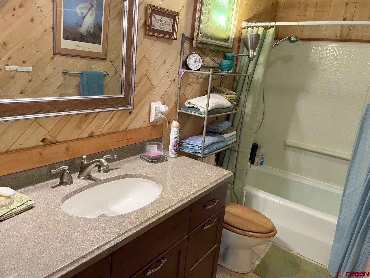 1201 Frontier Road Delta, CO 81416 - Photo 13 of 21 a bathroom with a sink toilet and shower