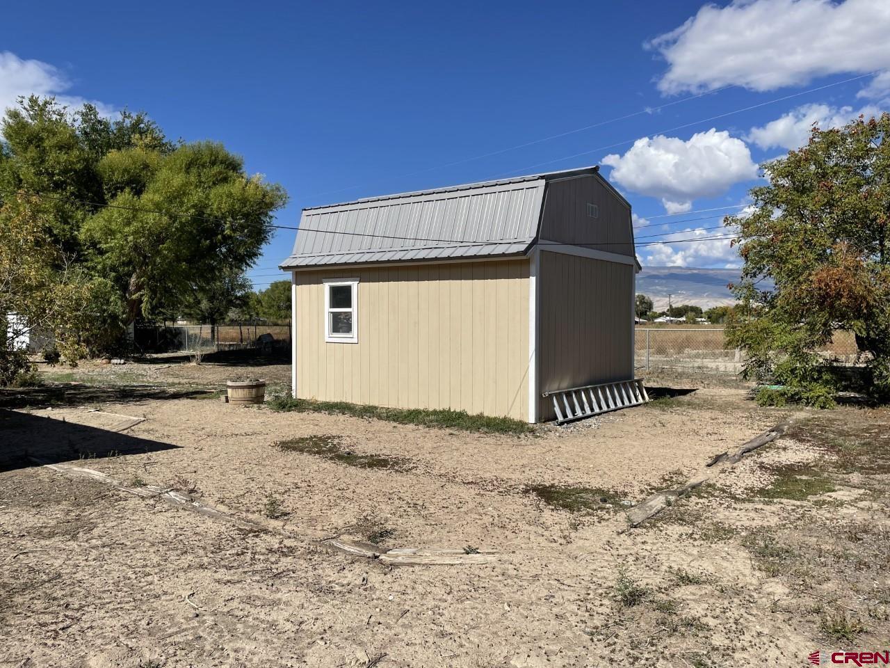 1201 Frontier Road Delta, CO 81416 - Photo 17 of 21 a view of a house with a snow in the background