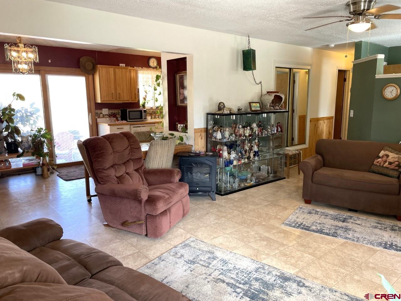 1201 Frontier Road Delta, CO 81416 - Photo 2 of 21 a living room with furniture and a large window