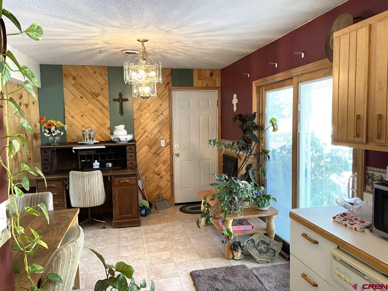 1201 Frontier Road Delta, CO 81416 - Photo 7 of 21 a living room filled with furniture window and potted plant